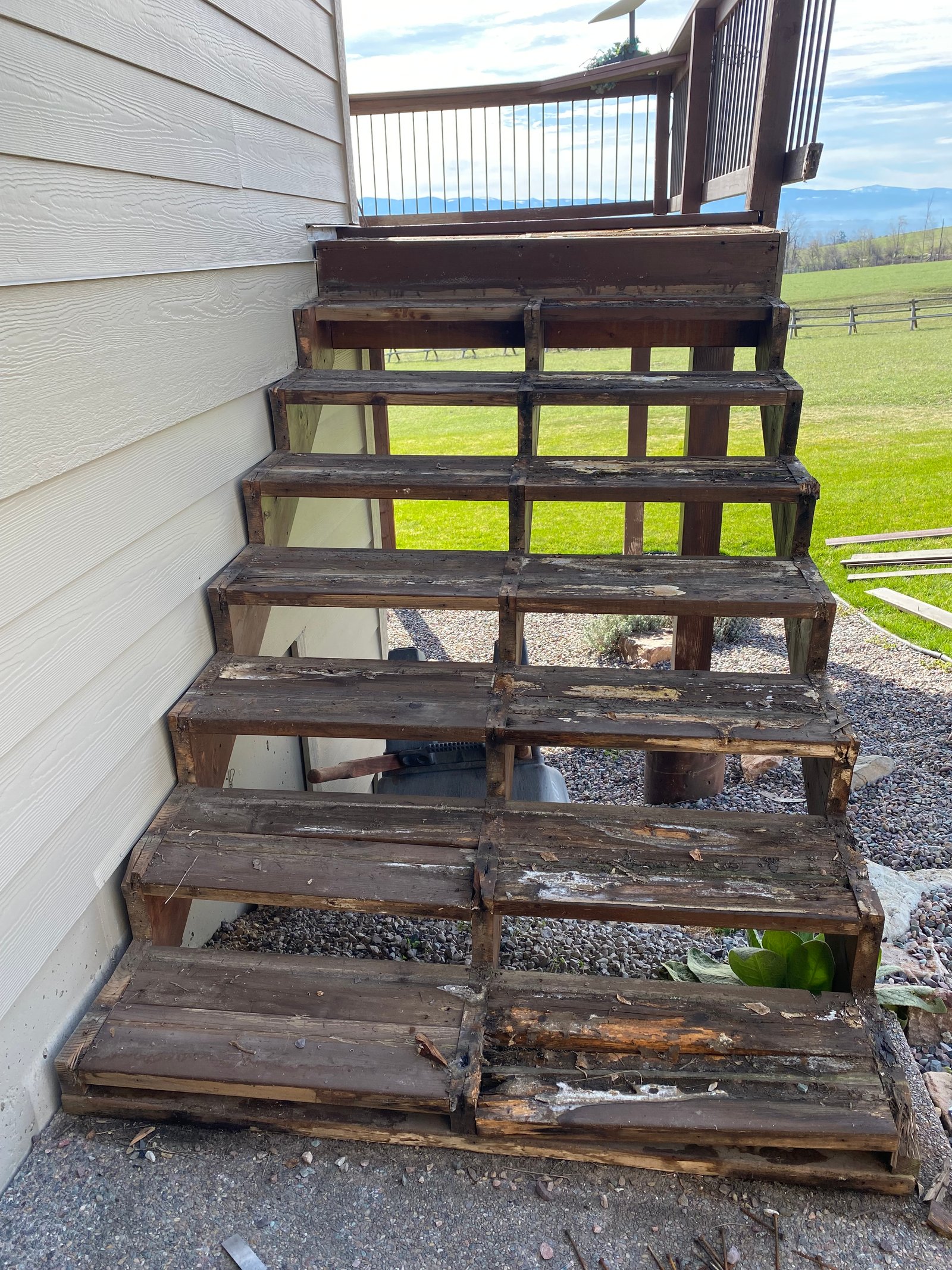 Before photo of rotten exterior stairs needing replacement